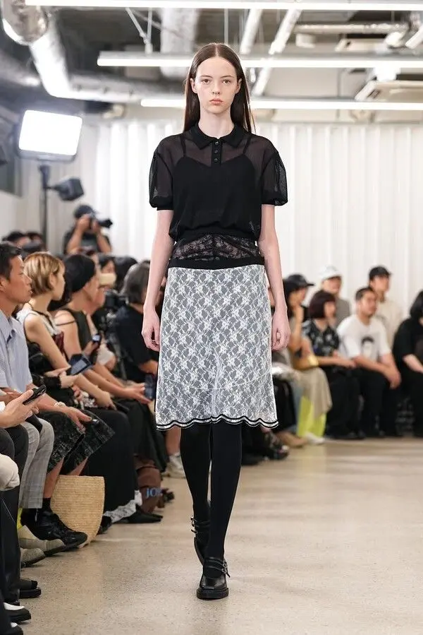 a model on ramp showing Akikoaoki brand clothing look