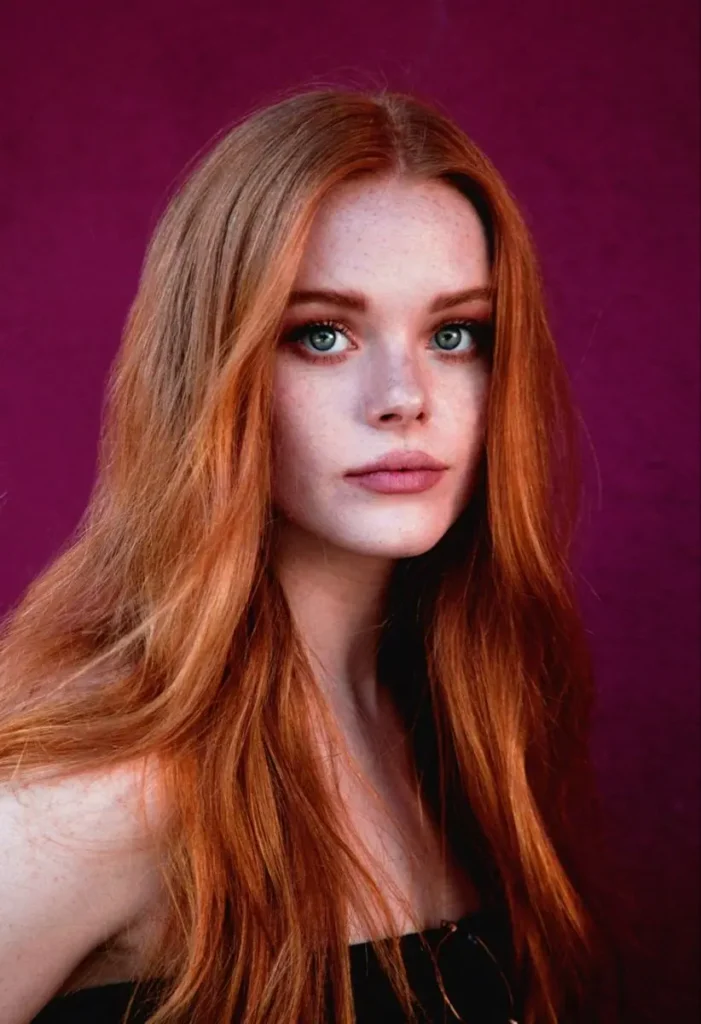 a girl with classic perfect shing copper hair color