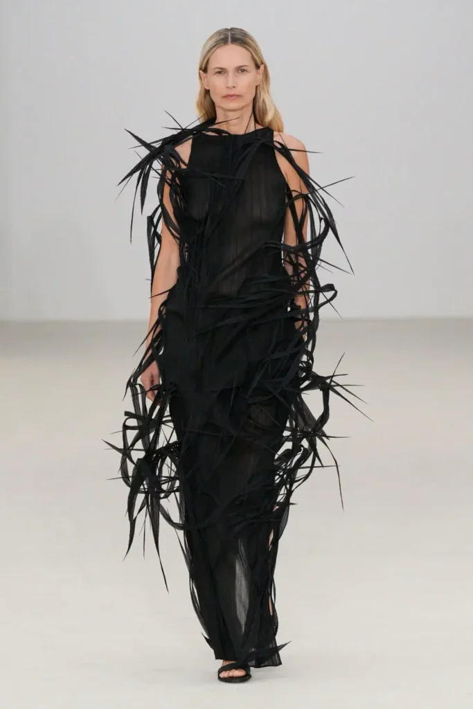 a model on ramp showing Issey-Miyake-Spring-2026 collection