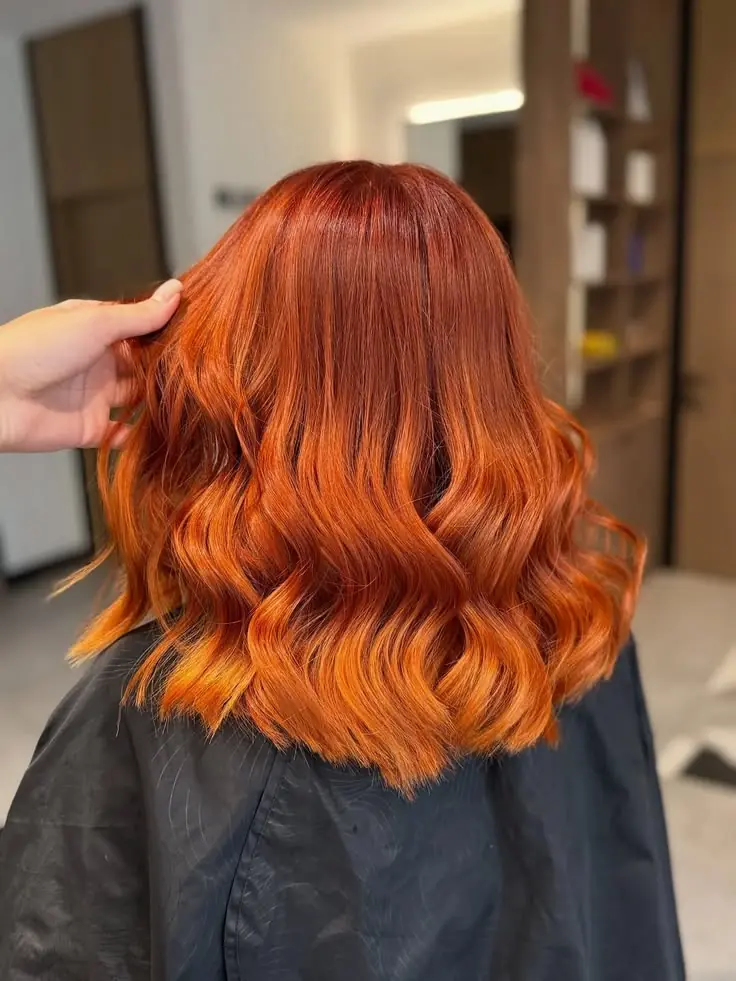 Vibrant Vivid Copper haircolor on a girl hairs