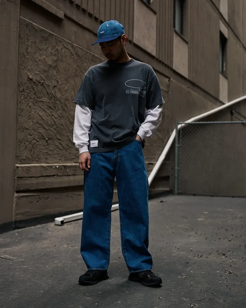 a boy showing WTAPS brand clothing