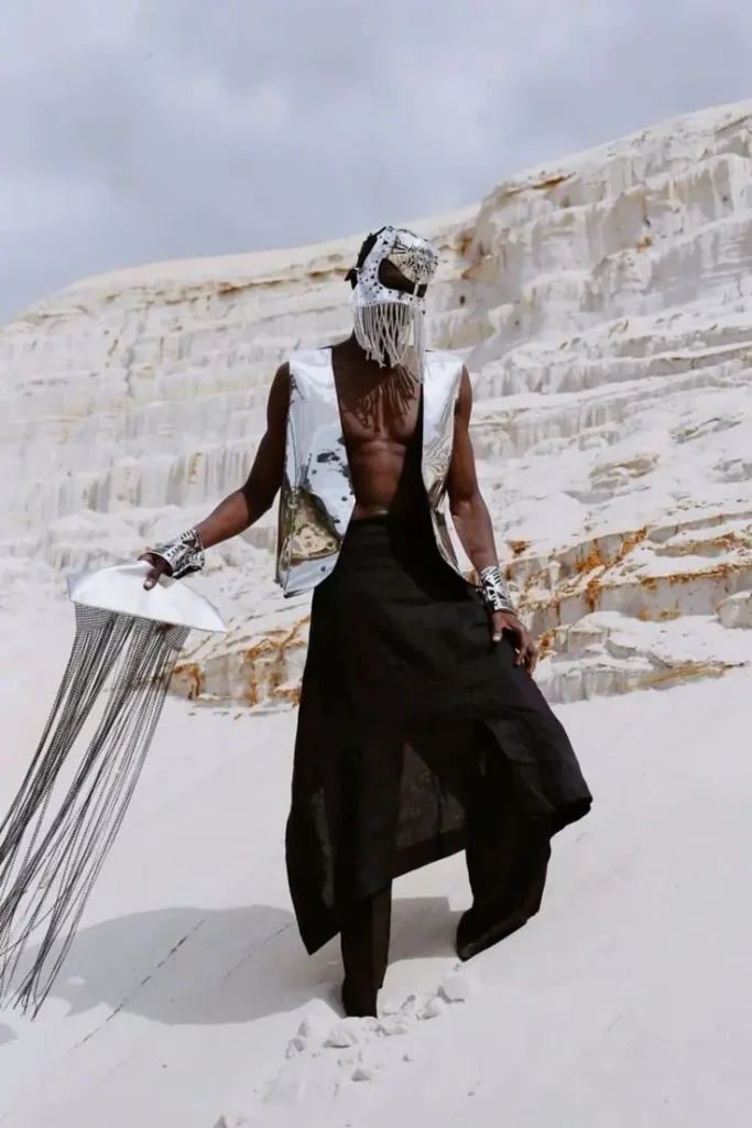 avant-garde artistic look on a man in burning man concert