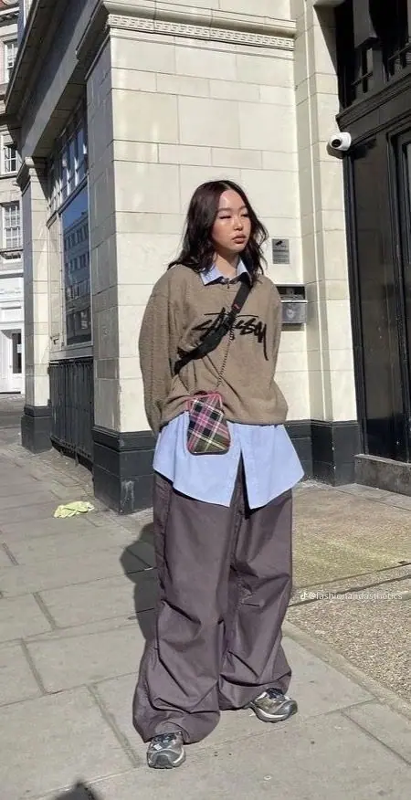 a woman in Hybrid Gorpcore dress