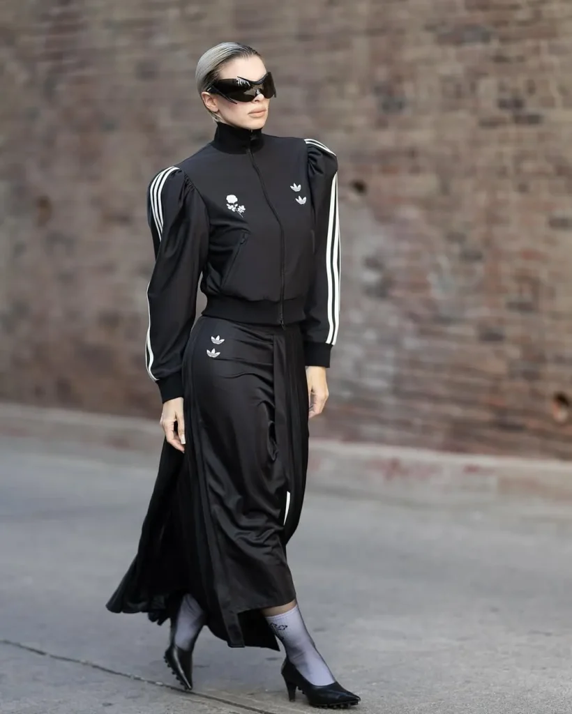 a female model wearing Willy Chavarria x Addidas collection