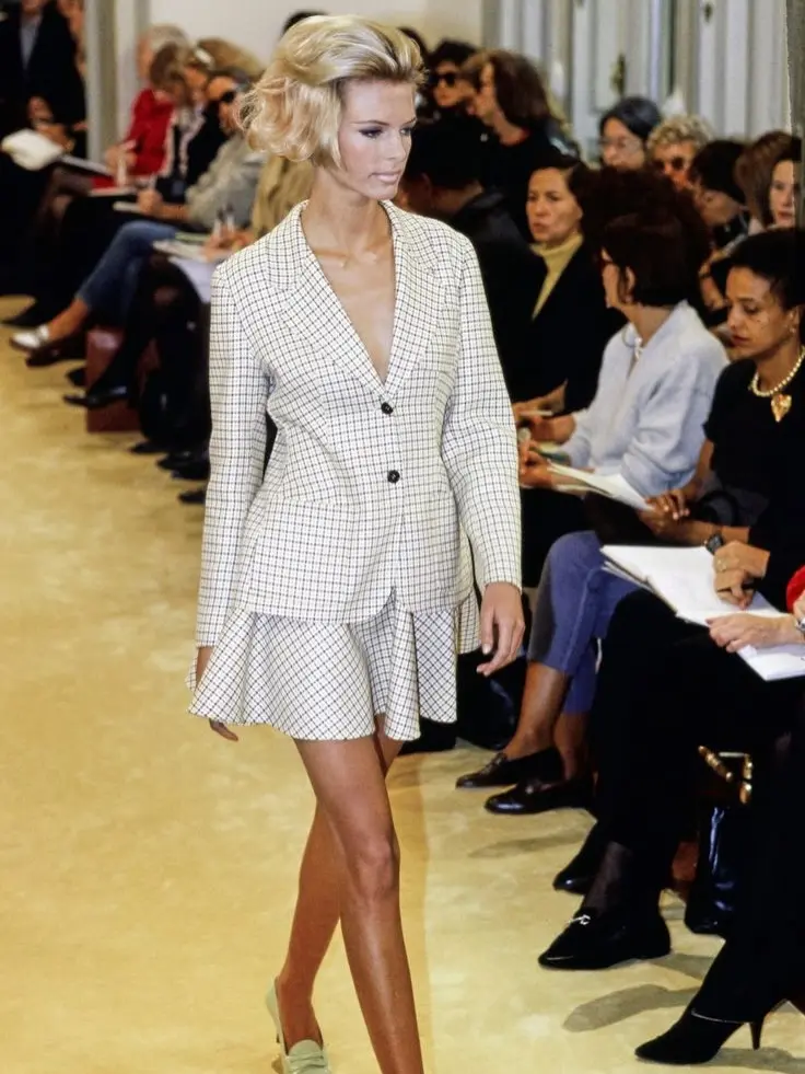 a female model of prada on ramp wearing there 1990 collection dress