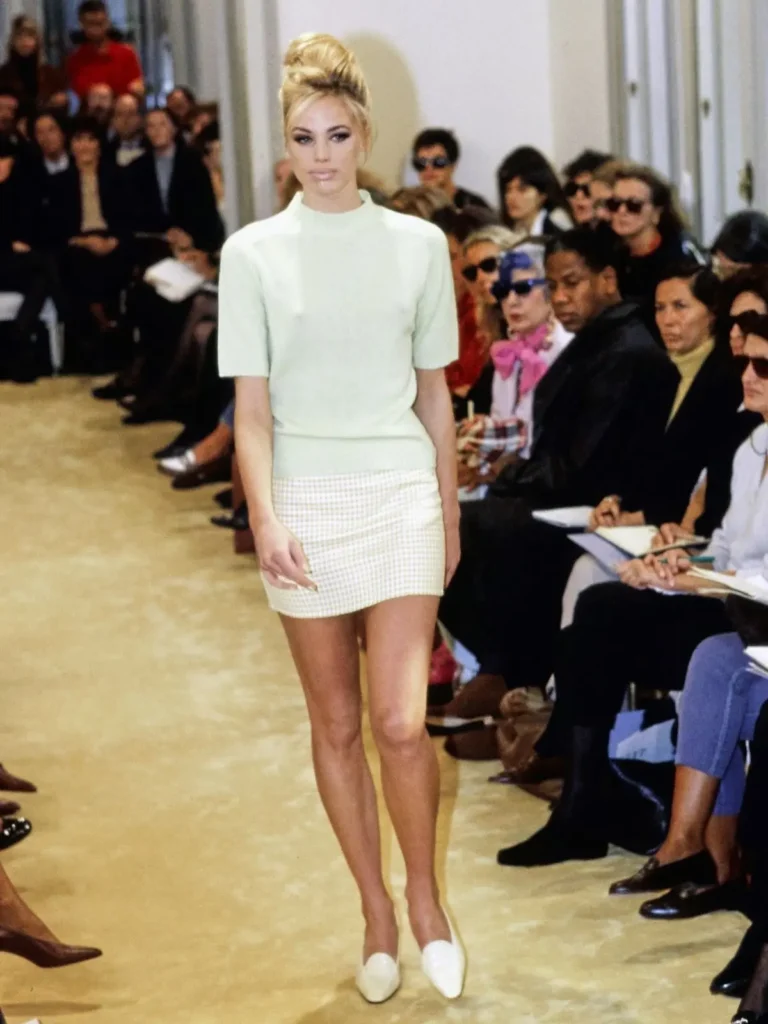 a female model of prada on ramp wearing there 1990 collection dress