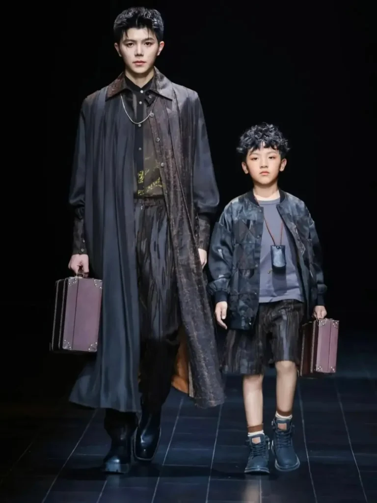 1 male and a boy on ramp showcasing Era Kuang look