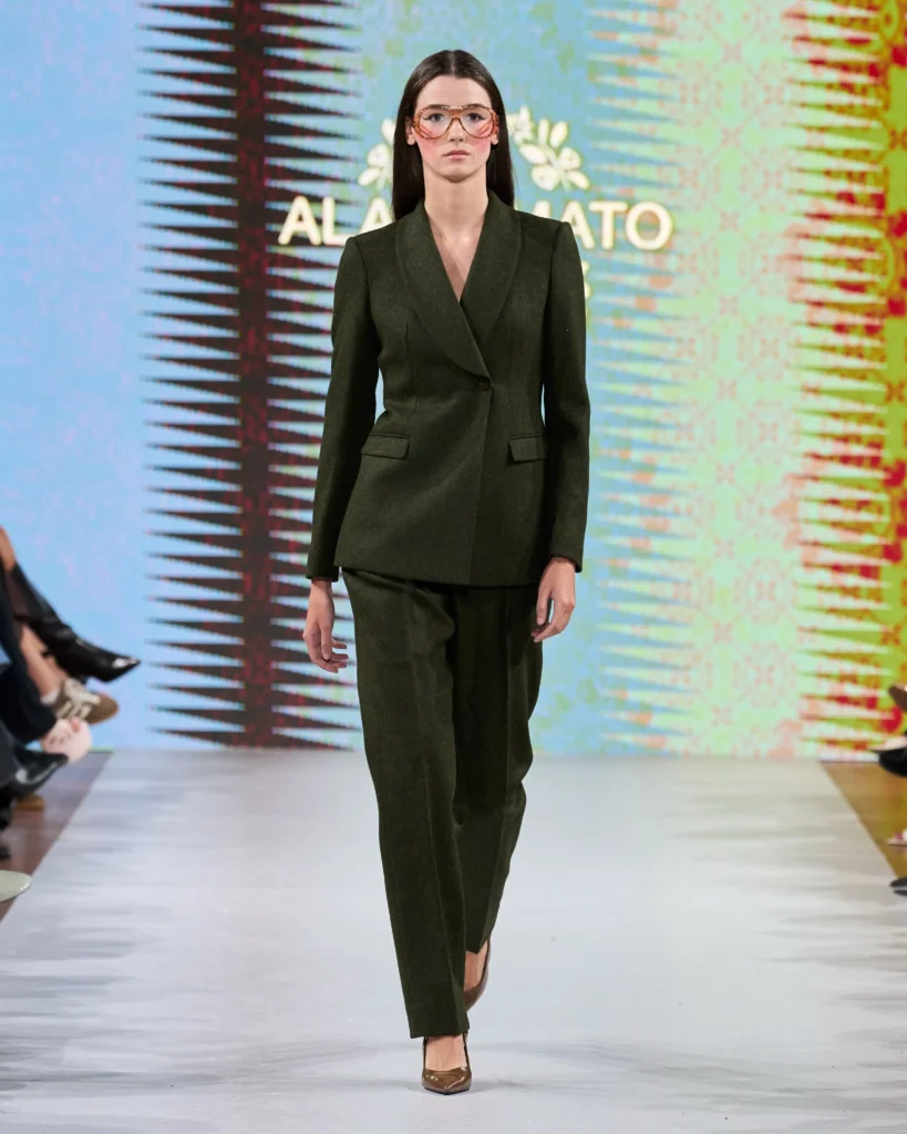 a female model on runway presenting Amato Moda collection look
