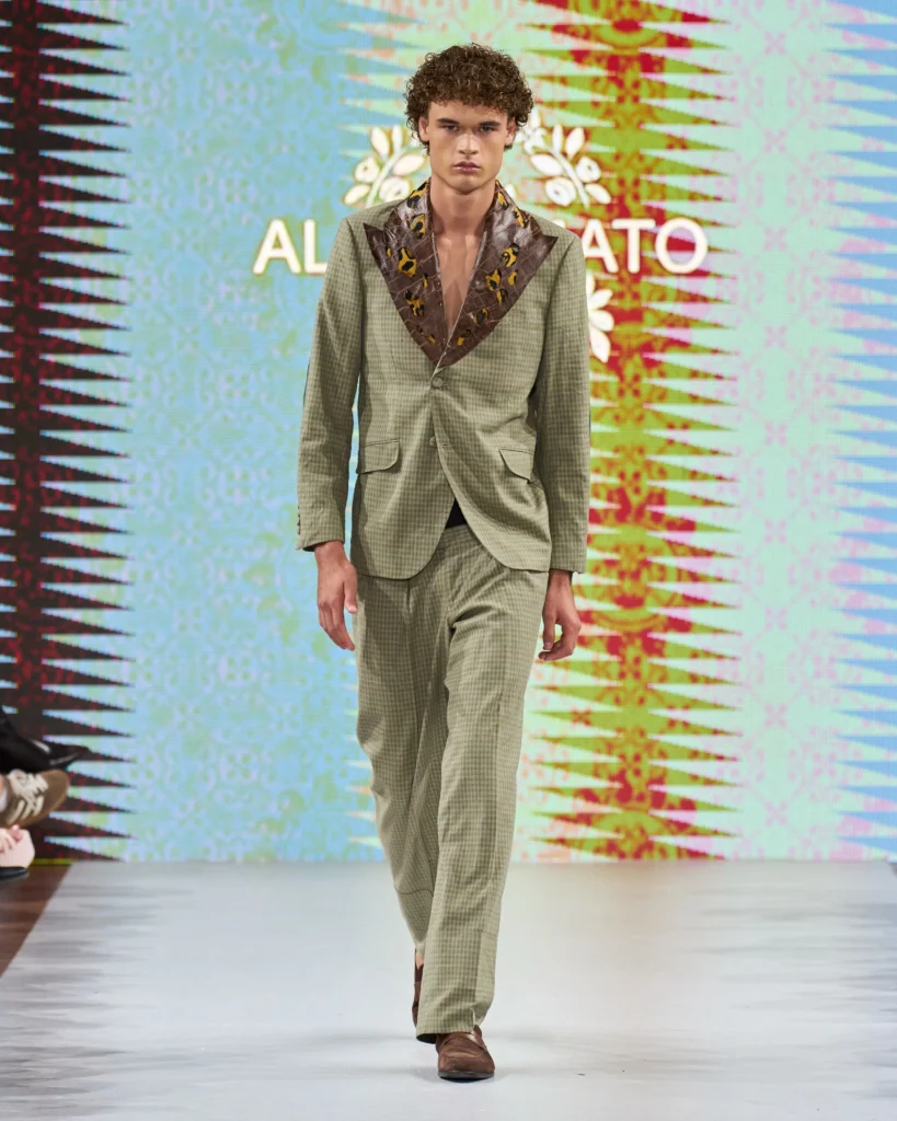 a male model on runway presenting Amato Moda collection look