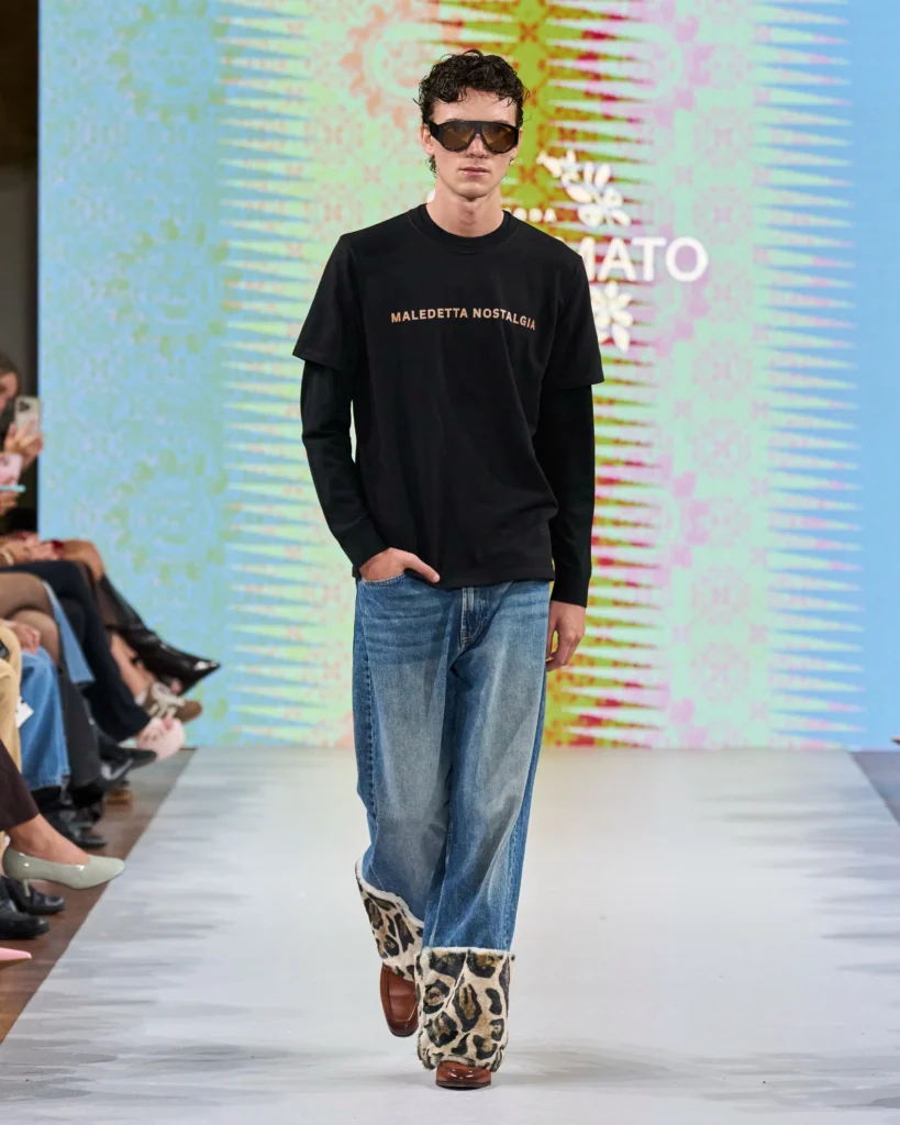 a male model on runway presenting Amato Moda collection look
