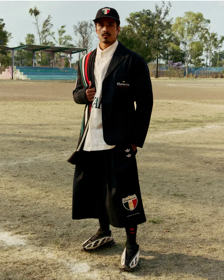 a male model wearing Willy Chavarria x Addidas collection