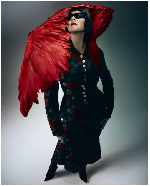a women in Ilya Migmoon wing dress